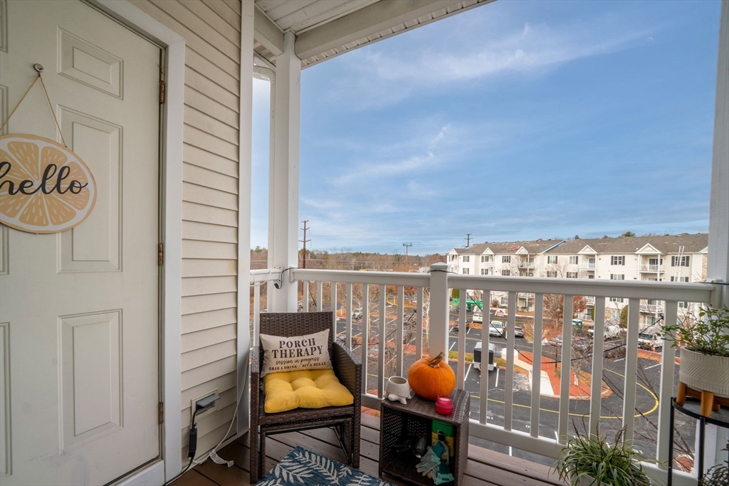 21 Hampshire Road, Unit 412 Methuen, MA 01844 - Photo 14 of 17 a view of a balcony with an outdoor seating
