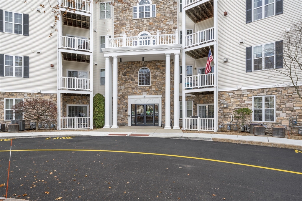21 Hampshire Road, Unit 412 Methuen, MA 01844 - Photo 2 of 17 a front view of a building with a glass windows