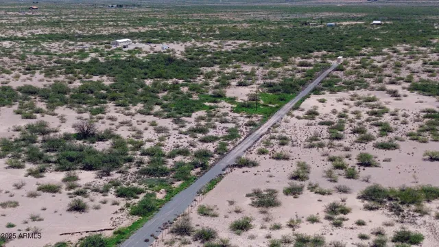 a view of a city with lush green forest