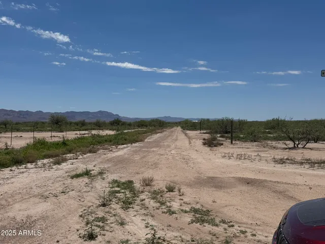 a view of swimming pool with a yard