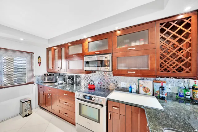 a kitchen that has a lot of cabinets in it