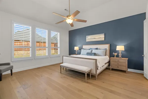 a bed room with a bed and a chandelier