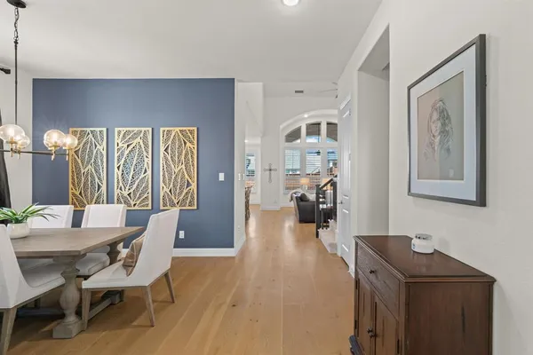 a view of a livingroom with furniture and wooden floor