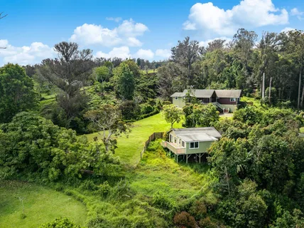 an aerial view of a house with swimming pool yard and outdoor seating