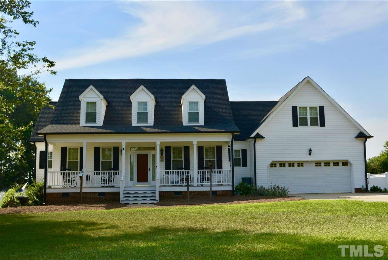 1004 Tyler Farms Drive Raleigh, NC 27603 - Photo 1 of 29 a view of an house with swimming pool and garden