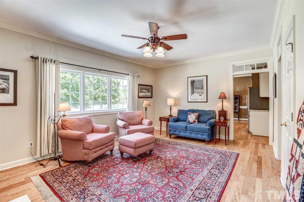 1004 Tyler Farms Drive Raleigh, NC 27603 - Photo 11 of 29 a living room with furniture and a rug