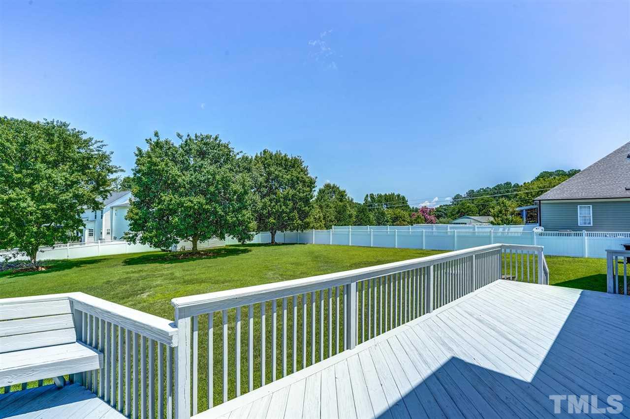 1004 Tyler Farms Drive Raleigh, NC 27603 - Photo 23 of 29 a view of a wooden deck and a yard
