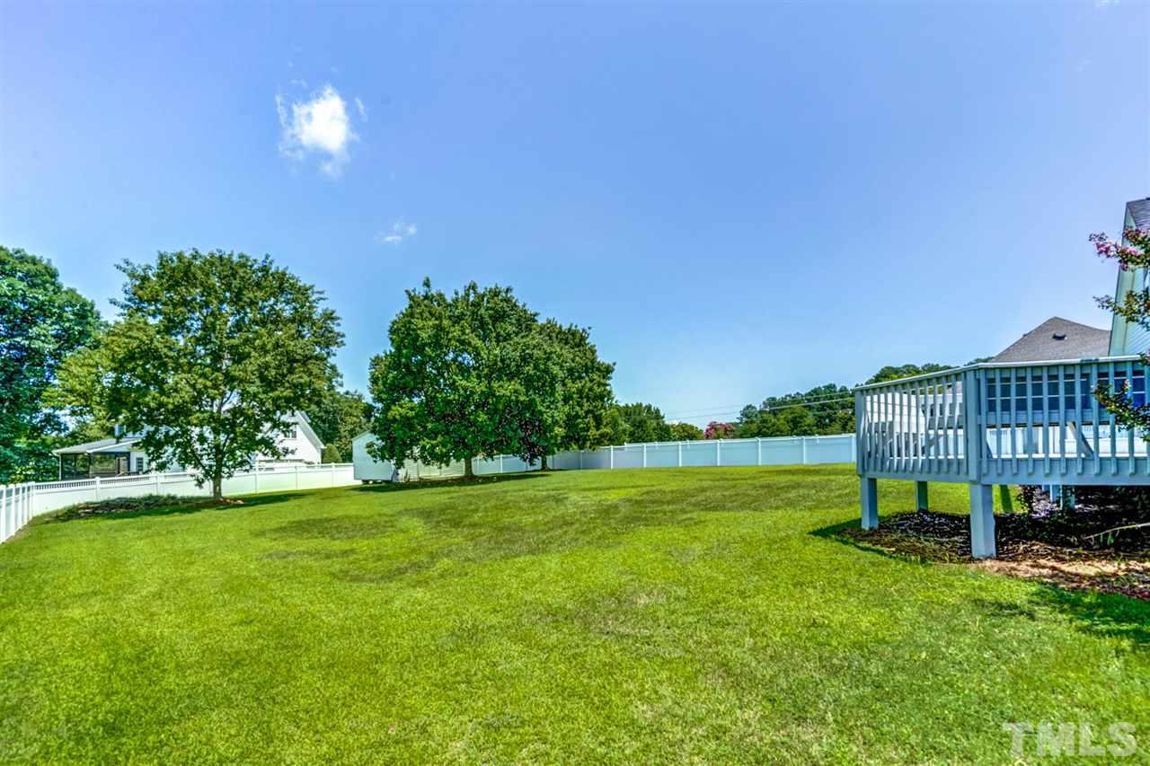 1004 Tyler Farms Drive Raleigh, NC 27603 - Photo 25 of 29 a view of a house with a big yard