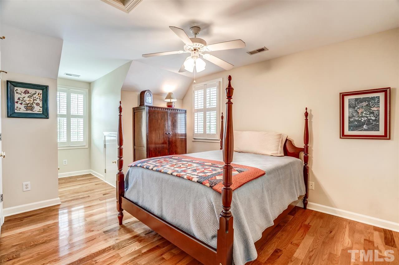 1004 Tyler Farms Drive Raleigh, NC 27603 - Photo 27 of 29 a bedroom with a bed and a table