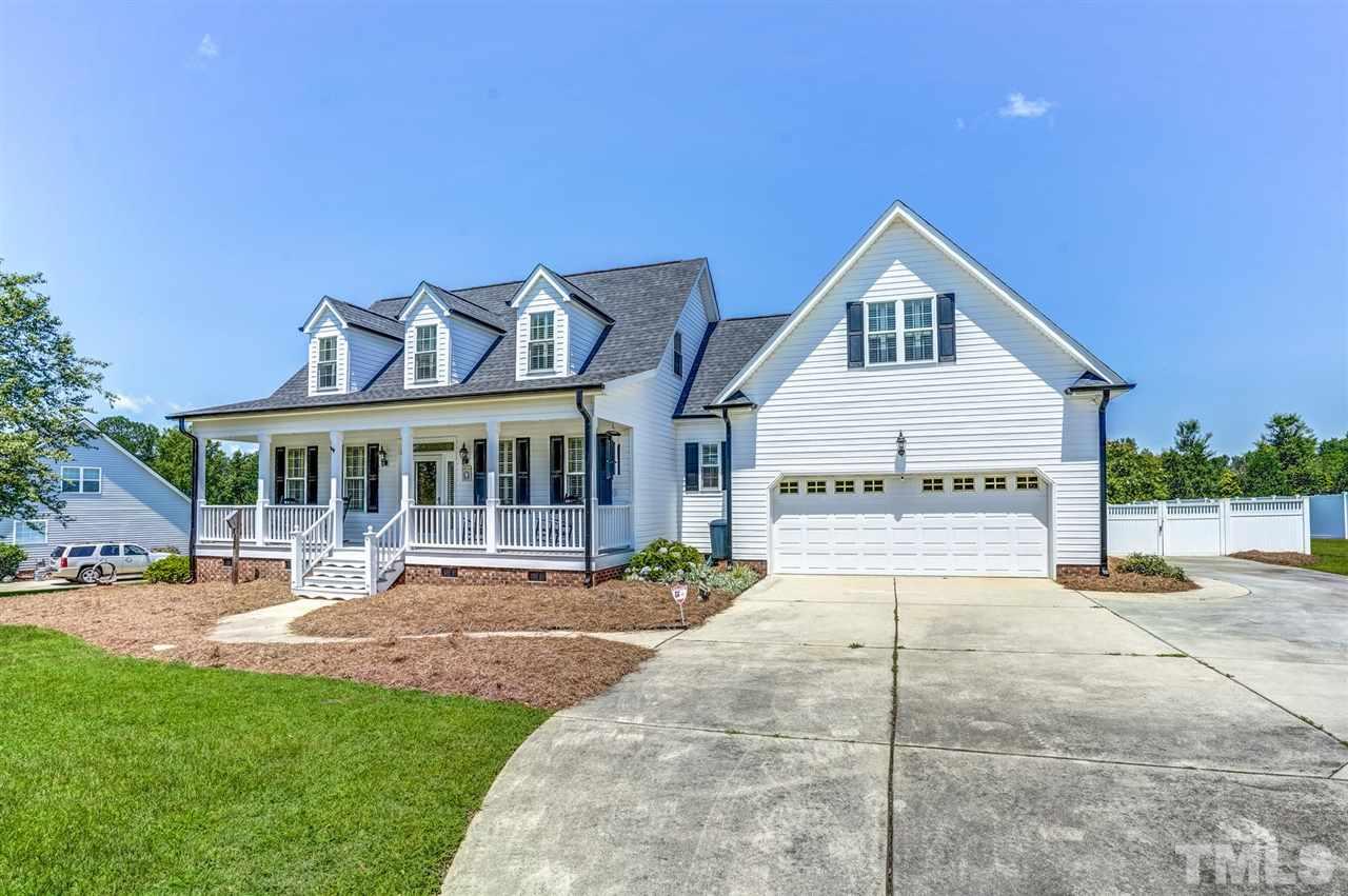 1004 Tyler Farms Drive Raleigh, NC 27603 - Photo 28 of 29 a view of a house with a yard and sitting area