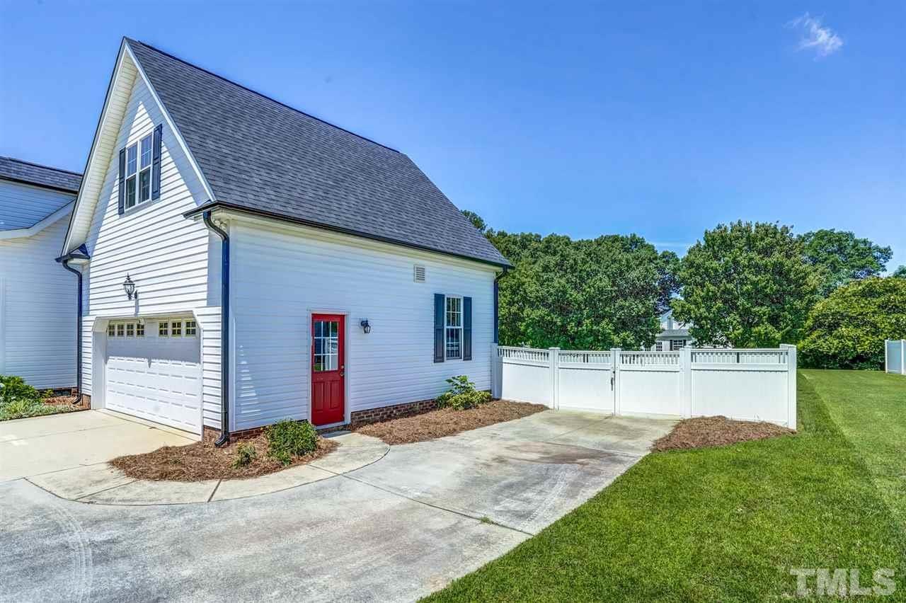 1004 Tyler Farms Drive Raleigh, NC 27603 - Photo 29 of 29 a front view of a house with a yard and garage