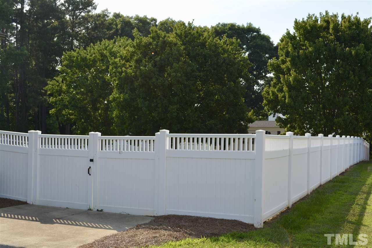 1004 Tyler Farms Drive Raleigh, NC 27603 - Photo 4 of 29 a view of a deck with a yard