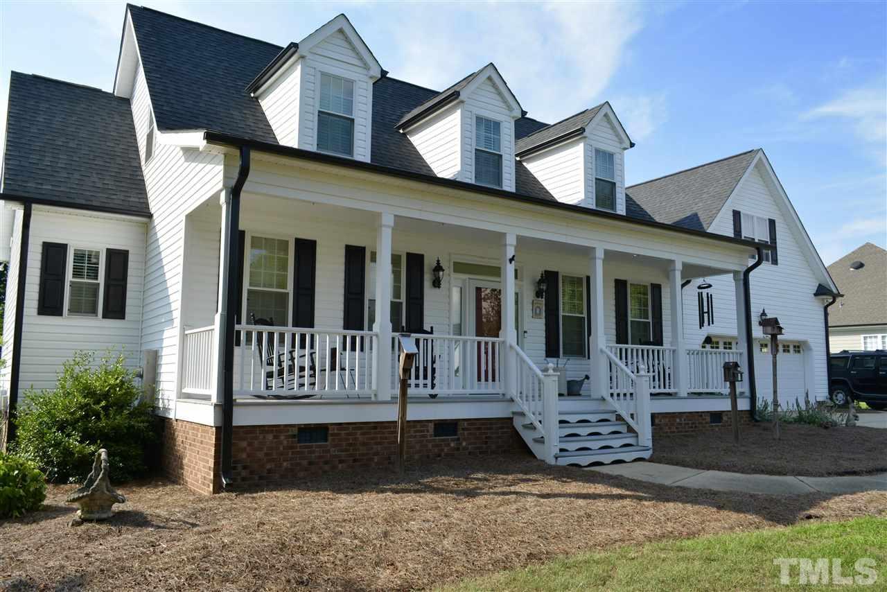1004 Tyler Farms Drive Raleigh, NC 27603 - Photo 6 of 29 a front view of a house with garden