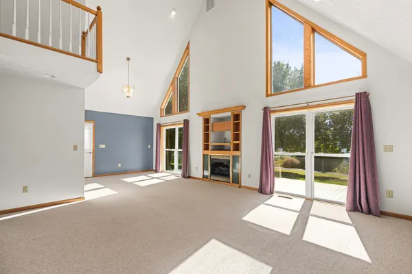 a view of an empty room with a balcony