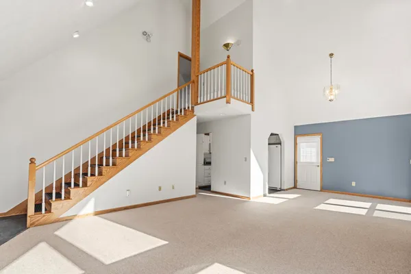 a view of an entryway with wooden floor