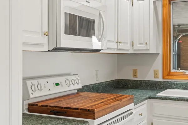 a view of cabinets and wooden floor