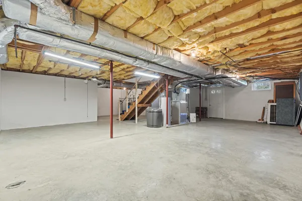 a view of an empty room with a fireplace