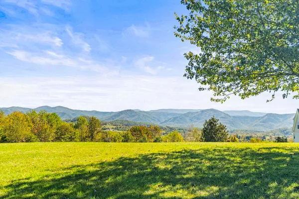 a view of an ocean and a mountain
