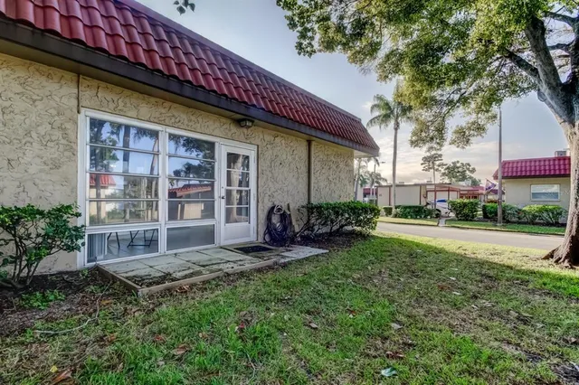 a view of a house with a yard