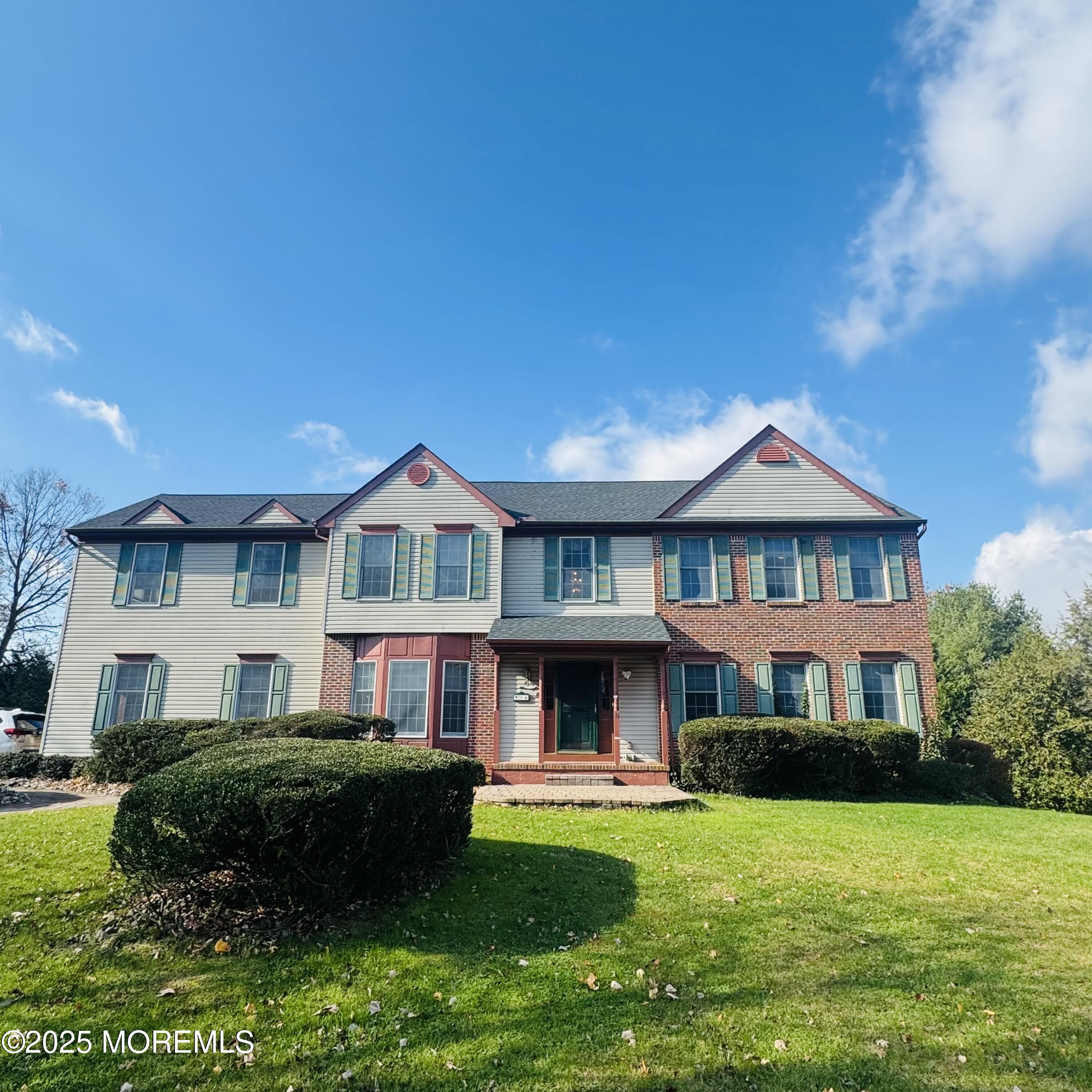 8 Ivy Lane Wrightstown, NJ 08562 - Photo 1 of 106 a front view of a house with a garden