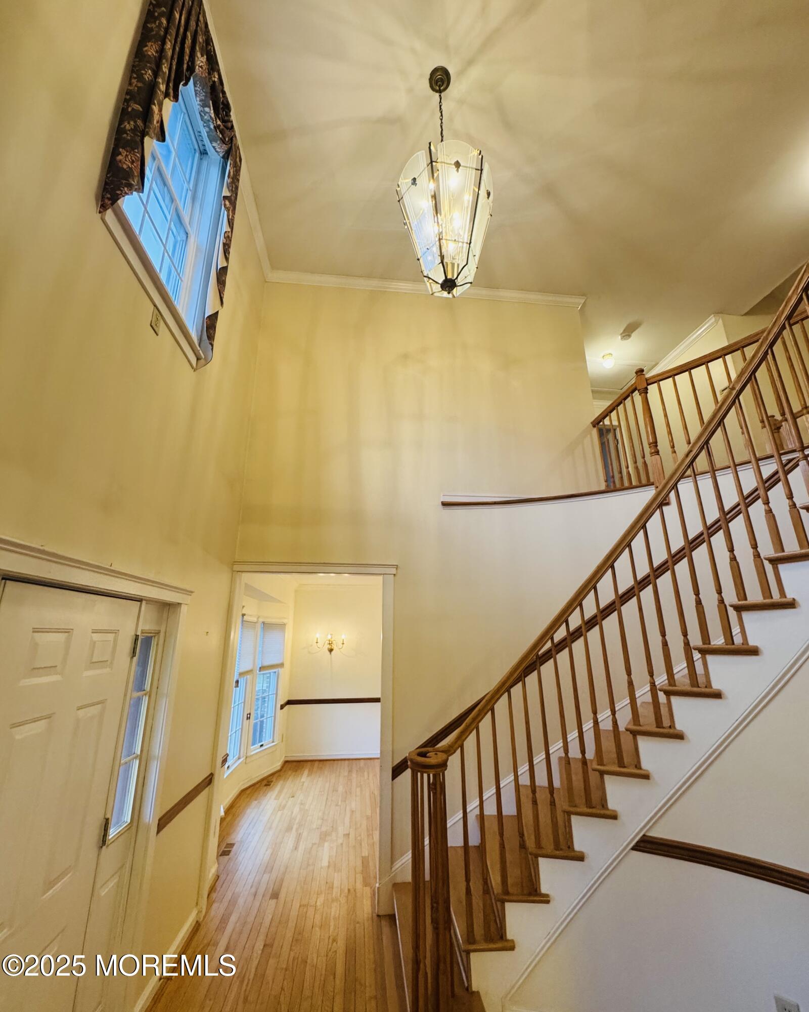 8 Ivy Lane Wrightstown, NJ 08562 - Photo 19 of 106 a view of a hallway with wooden floor and staircase