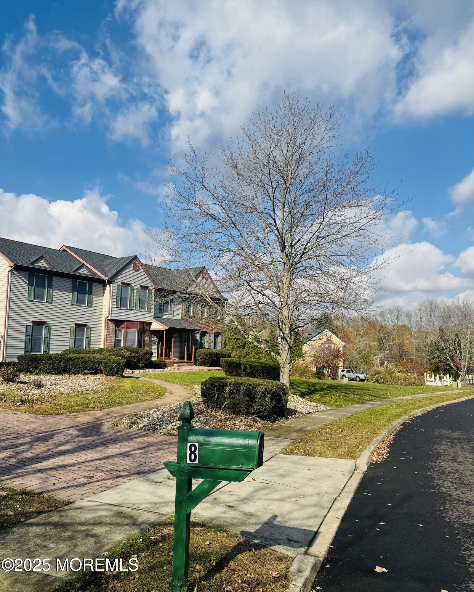 8 Ivy Lane Wrightstown, NJ 08562 - Photo 2 of 106 a view of a house with a big yard and large trees