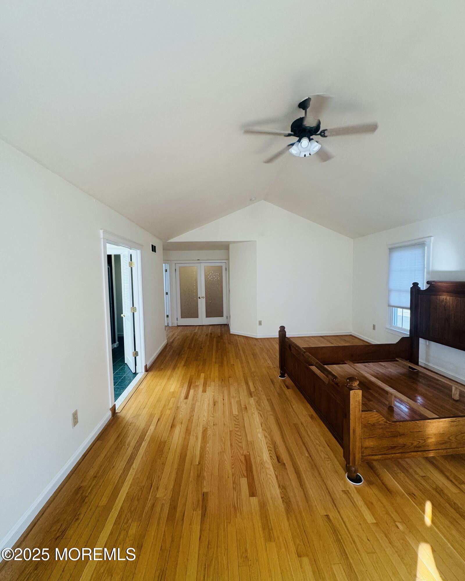 8 Ivy Lane Wrightstown, NJ 08562 - Photo 62 of 106 a bedroom with a bed and wooden floor