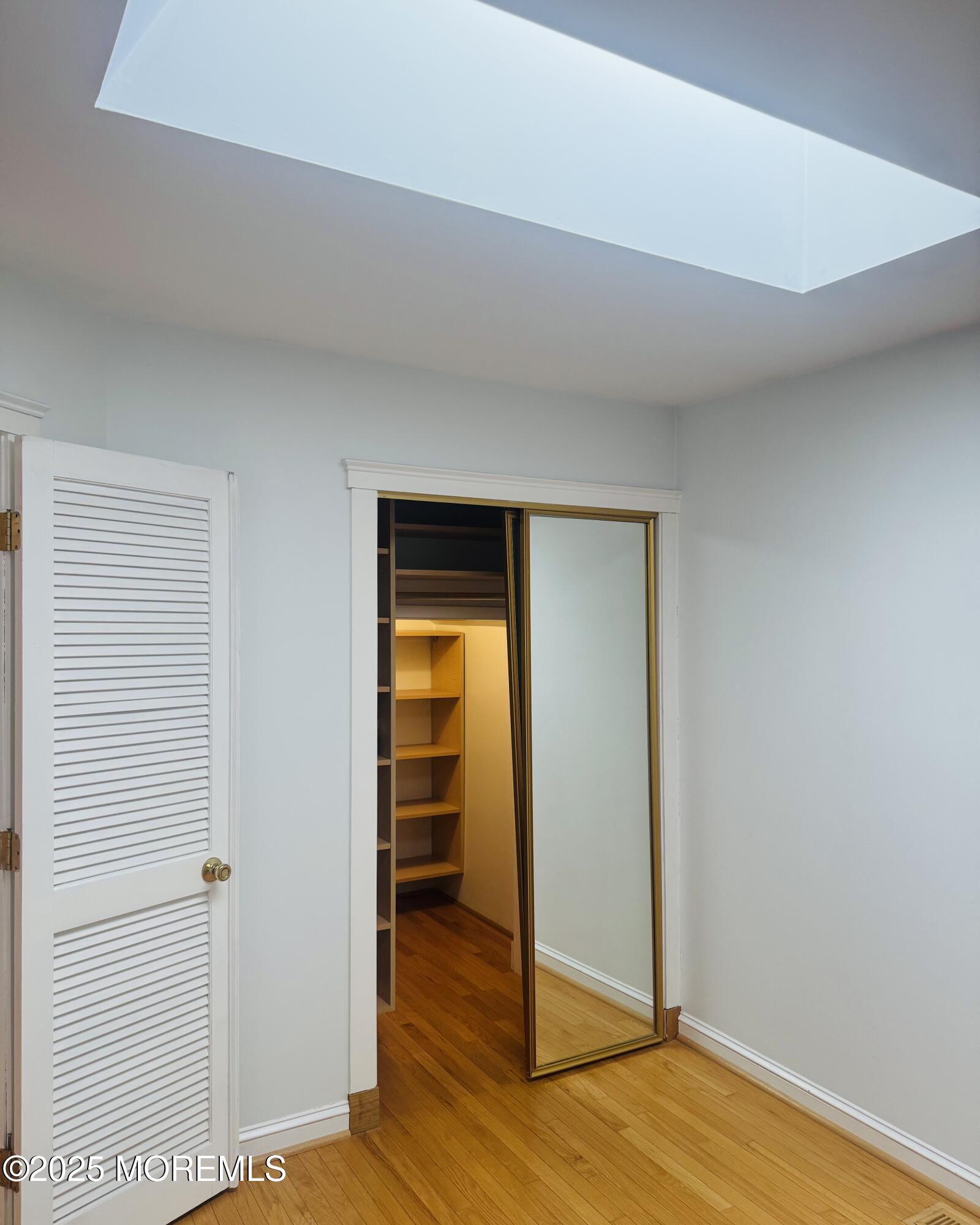8 Ivy Lane Wrightstown, NJ 08562 - Photo 65 of 106 an empty room with wooden floor closet and windows