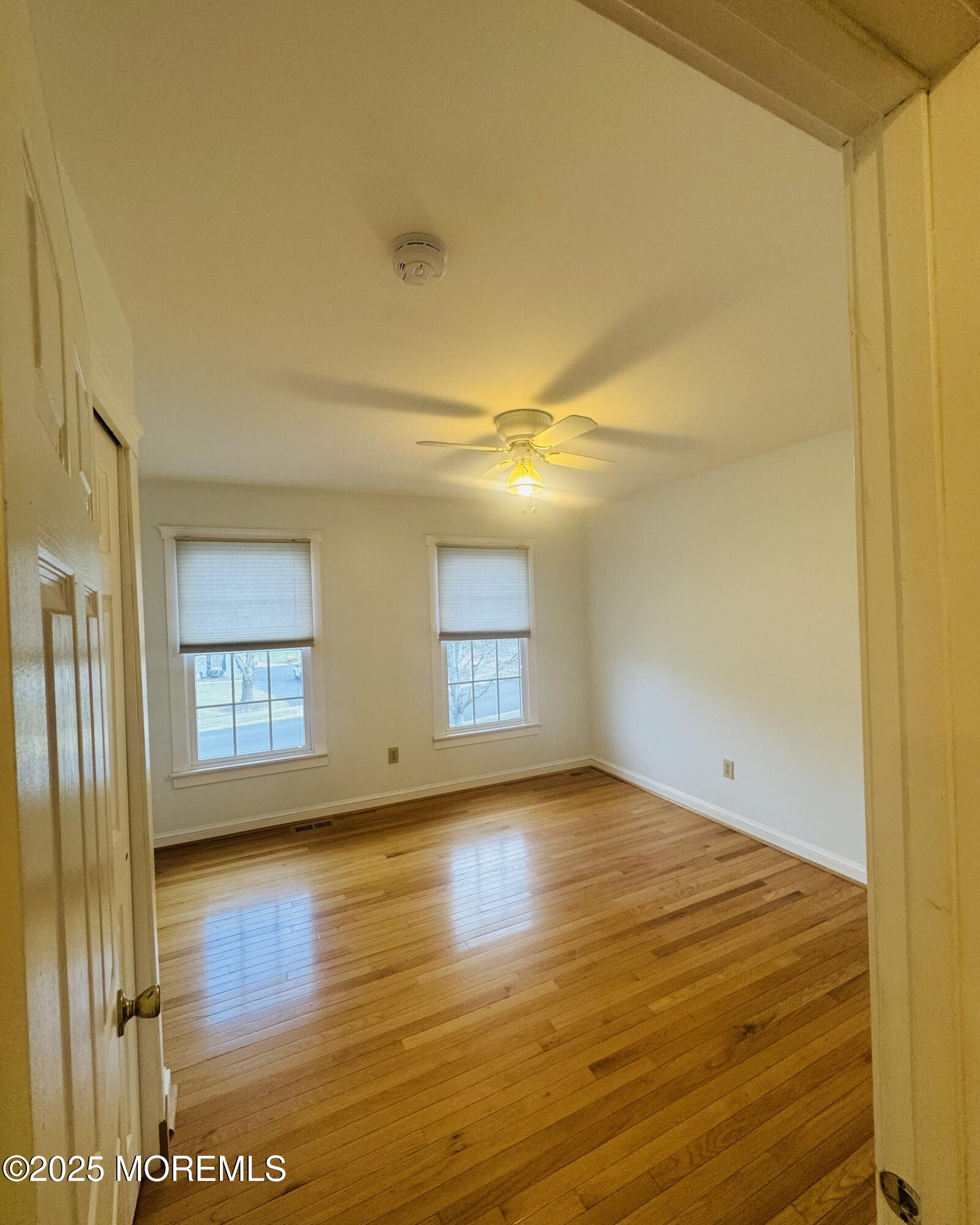 8 Ivy Lane Wrightstown, NJ 08562 - Photo 72 of 106 a view of empty room with wooden floor and fan