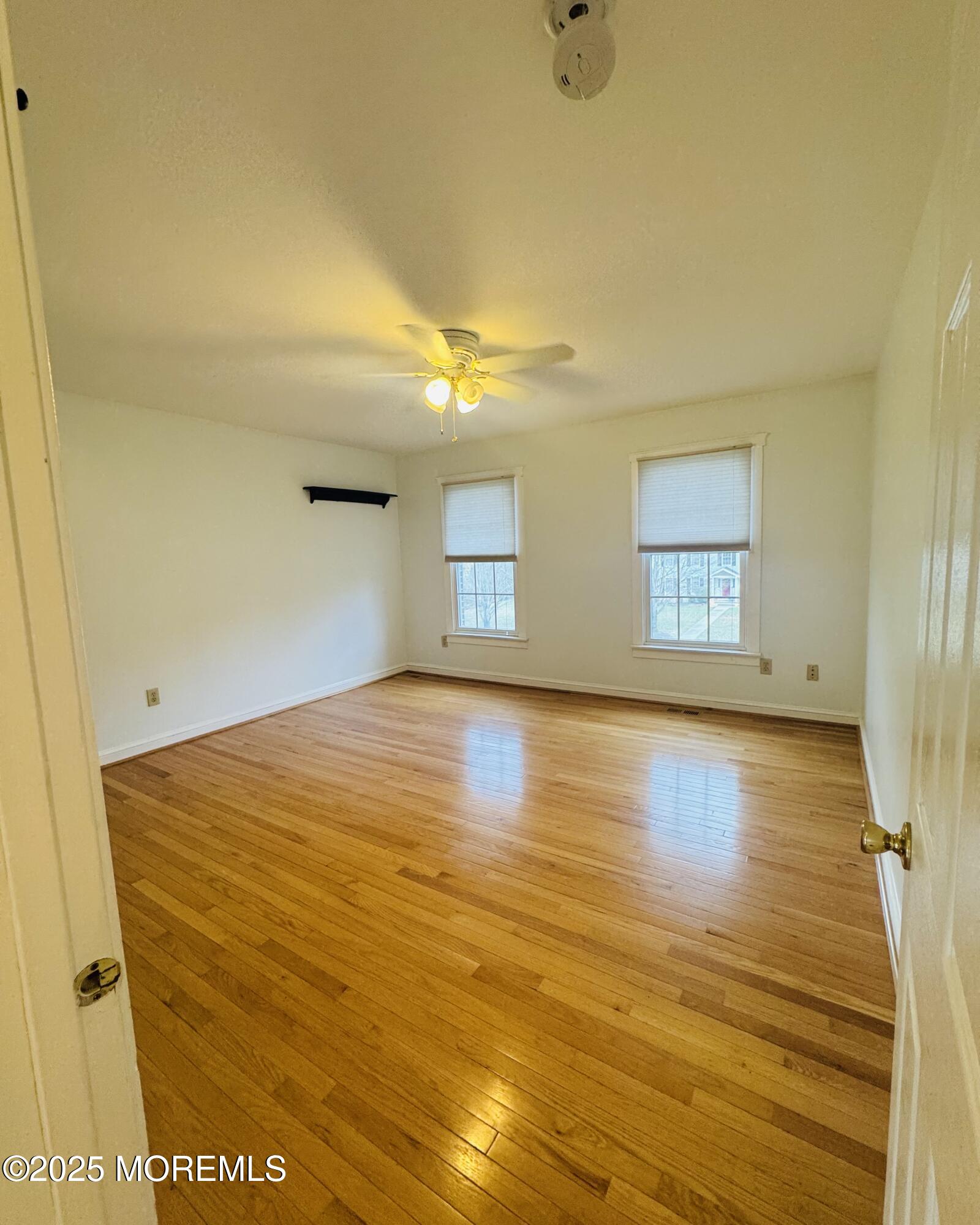 8 Ivy Lane Wrightstown, NJ 08562 - Photo 75 of 106 a view of empty room with wooden floor and fan