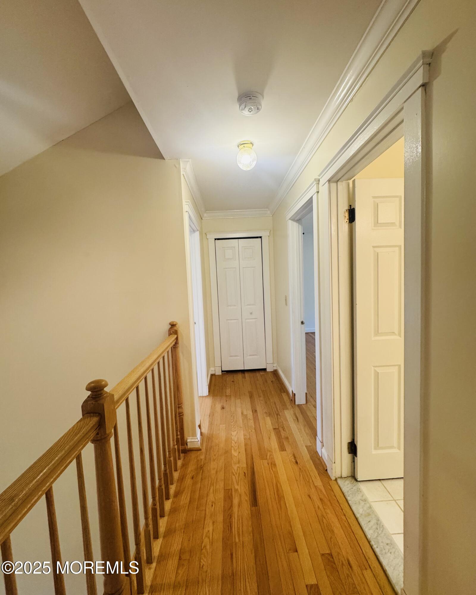 8 Ivy Lane Wrightstown, NJ 08562 - Photo 77 of 106 a view of a hallway with wooden floor and staircase