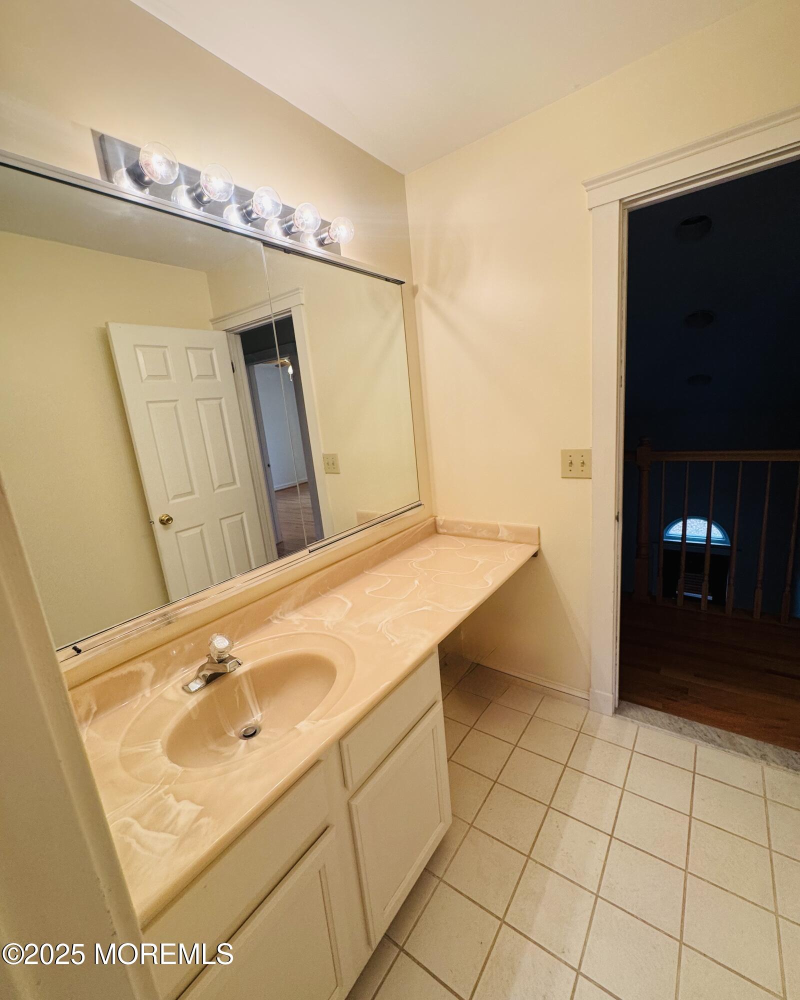 8 Ivy Lane Wrightstown, NJ 08562 - Photo 79 of 106 a bathroom with a sink and a mirror