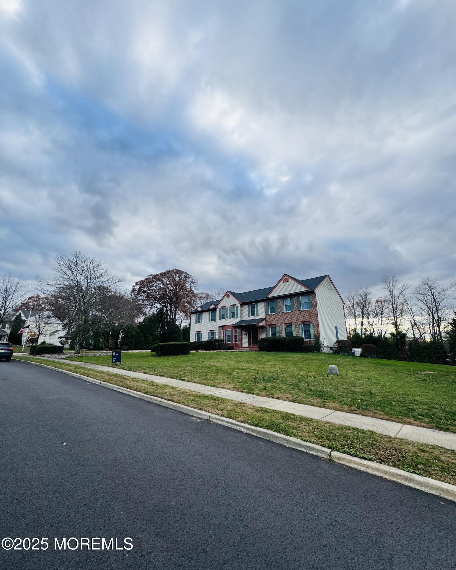 8 Ivy Lane Wrightstown, NJ 08562 - Photo 9 of 106 a view of a big house with a big yard and large trees