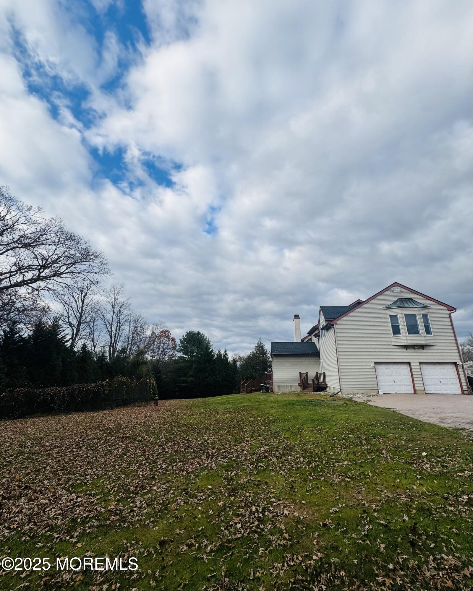 8 Ivy Lane Wrightstown, NJ 08562 - Photo 97 of 106 a view of a big house with a big yard and large trees