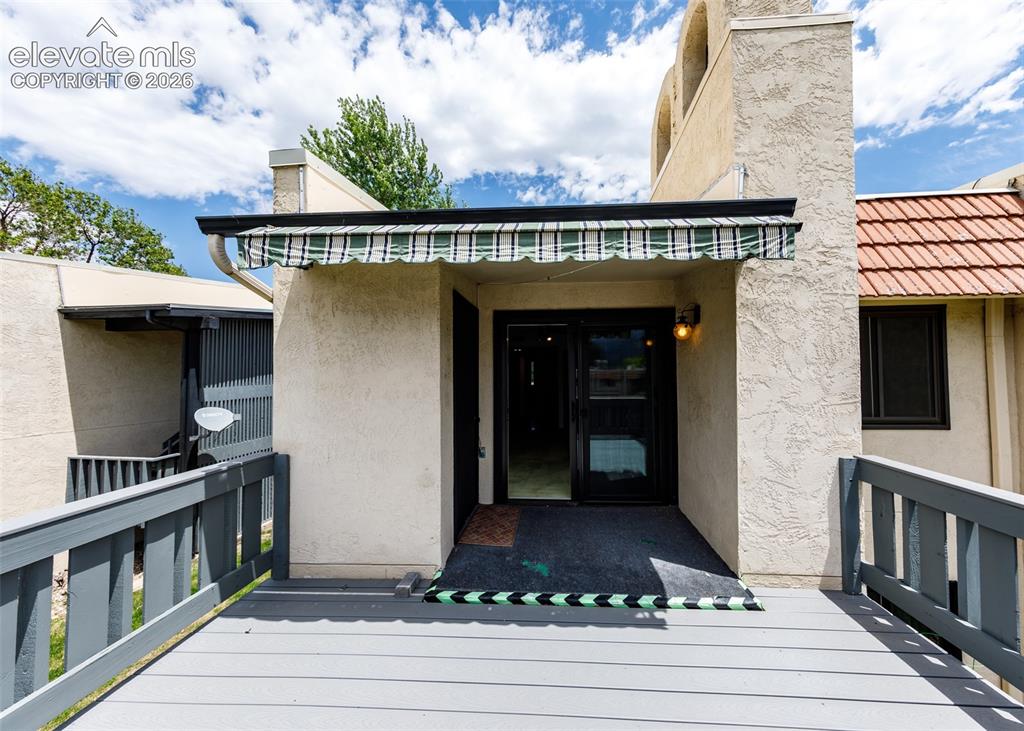 1034 Fontmore Road, Unit D Colorado Springs, CO 80904 - Photo 29 of 43 a front view of a house with entryway