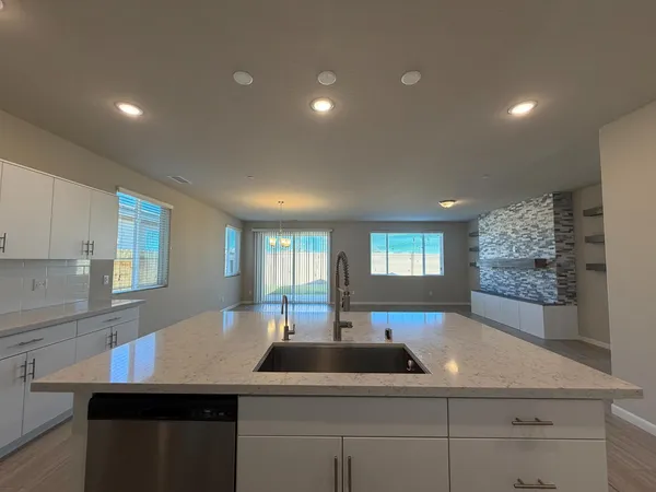 a kitchen with lots of counter space and two sink