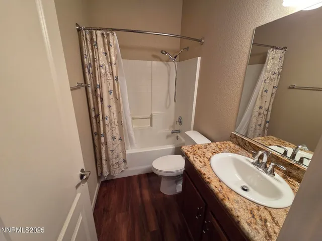 an empty room with windows and cabinet