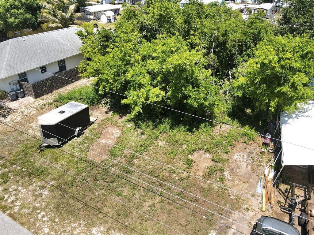 an aerial view of a house with yard swimming pool and outdoor seating