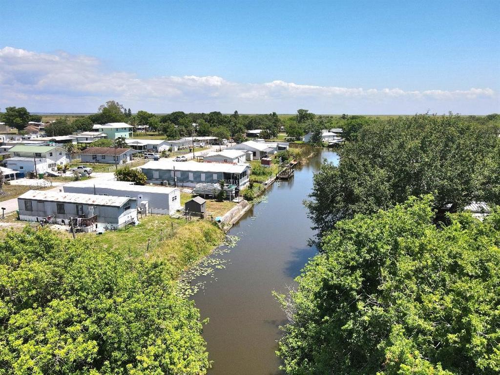 1211 9th Street Okeechobee, FL 34974 - Photo 4 of 4 a view of a lake with a city