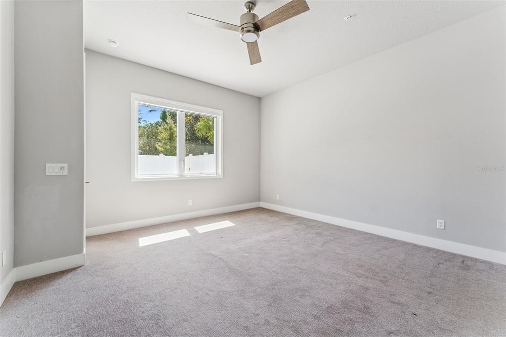 7760 Sandy Ridge Drive, Unit 112 Reunion, FL 34747 - Photo 12 of 23 an empty room with windows