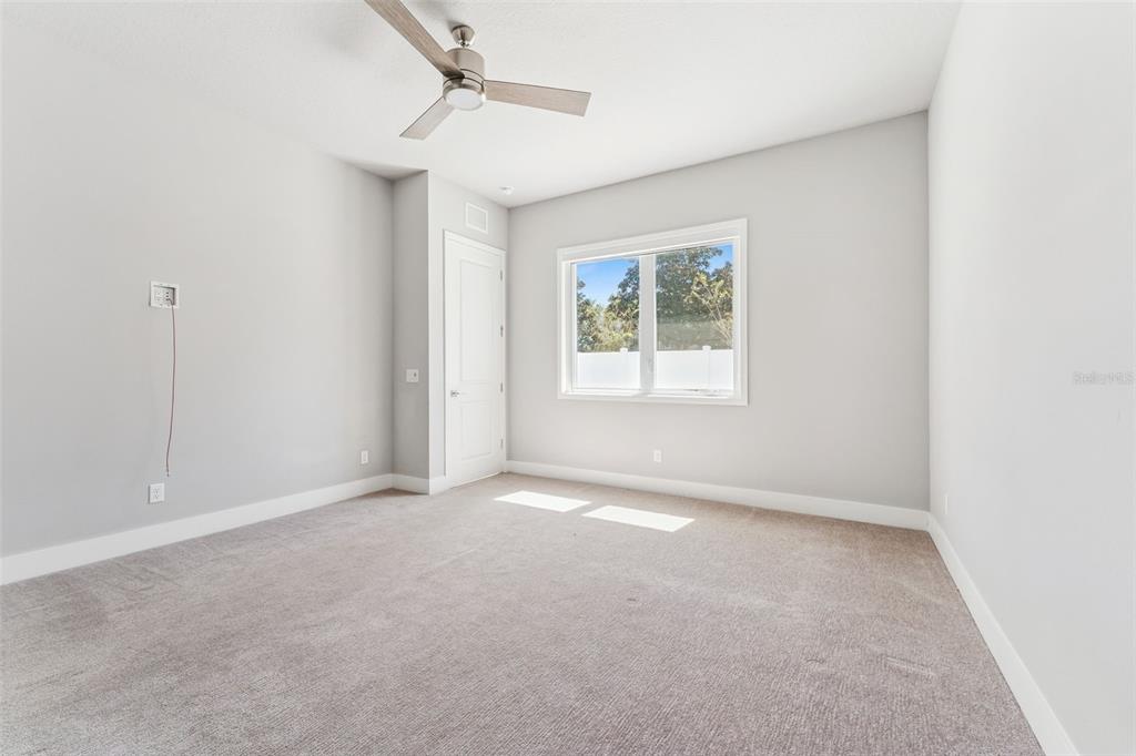 7760 Sandy Ridge Drive, Unit 112 Reunion, FL 34747 - Photo 15 of 23 an empty room with windows and closet