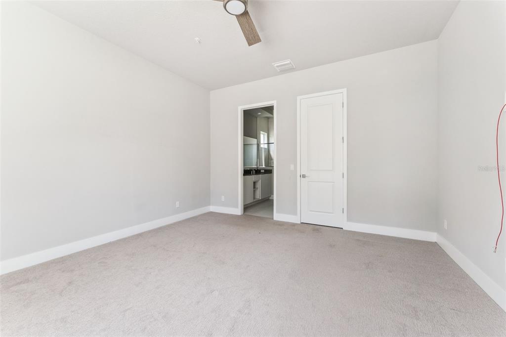7760 Sandy Ridge Drive, Unit 112 Reunion, FL 34747 - Photo 16 of 23 an empty room with an entryway