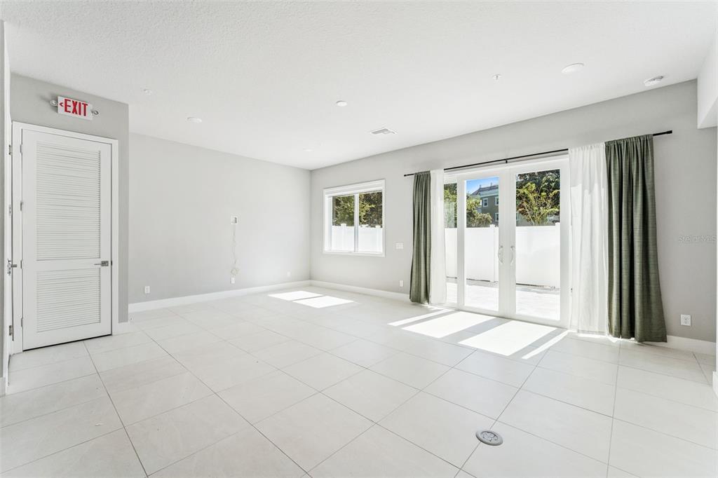 7760 Sandy Ridge Drive, Unit 112 Reunion, FL 34747 - Photo 6 of 23 an empty room with windows