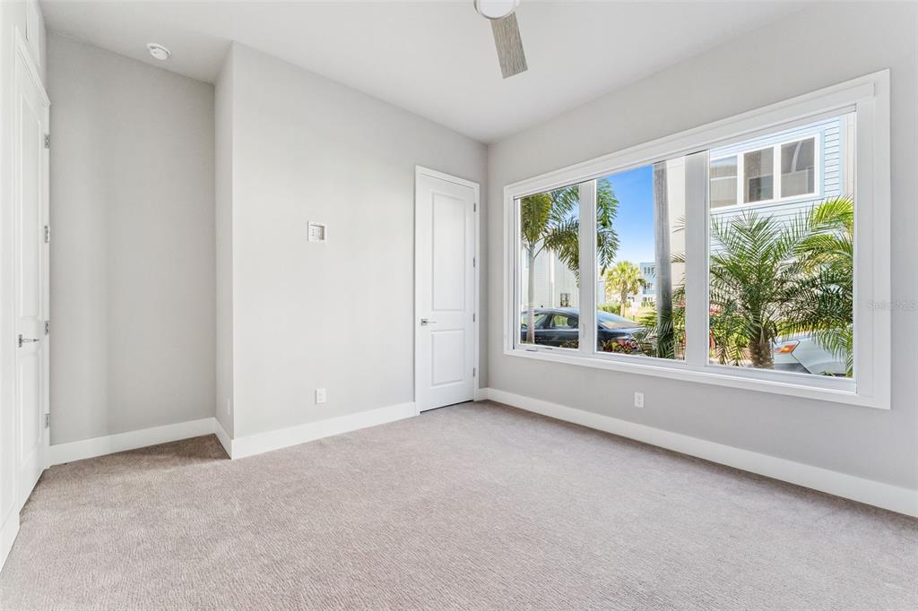 7760 Sandy Ridge Drive, Unit 112 Reunion, FL 34747 - Photo 10 of 23 an empty room with windows