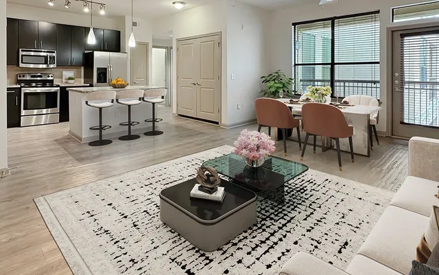 a living room with furniture and a table