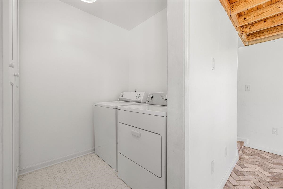 5626 Lamb Road Arlington, TN 38002 - Photo 15 of 33 a utility room with cabinets washer and dryer