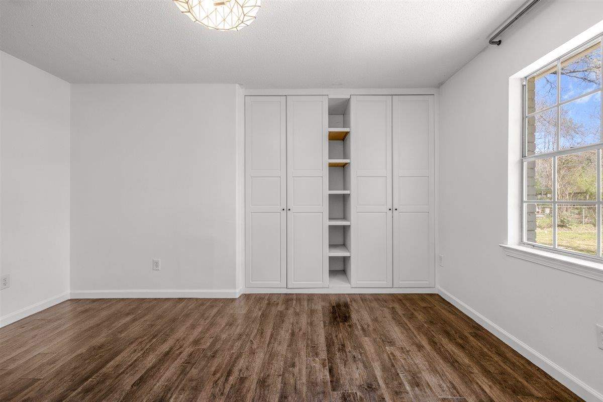 5626 Lamb Road Arlington, TN 38002 - Photo 21 of 33 an empty room with wooden floor and windows
