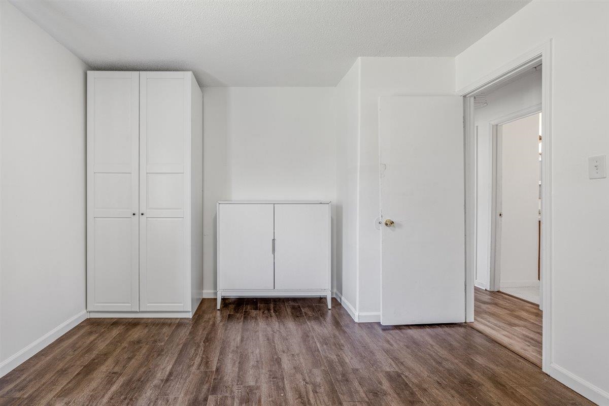 5626 Lamb Road Arlington, TN 38002 - Photo 25 of 33 a view of an empty room with closet and wooden floor