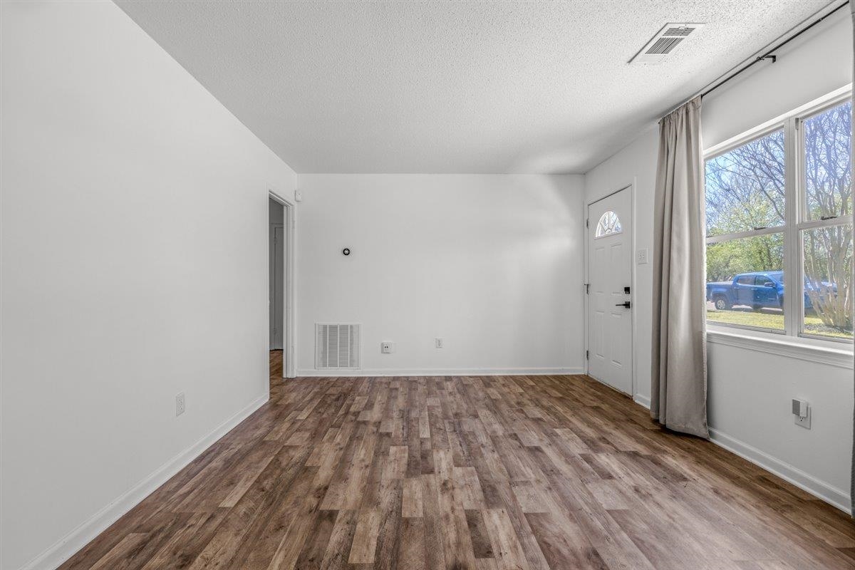 5626 Lamb Road Arlington, TN 38002 - Photo 9 of 33 a view of a room with wooden floor and windows