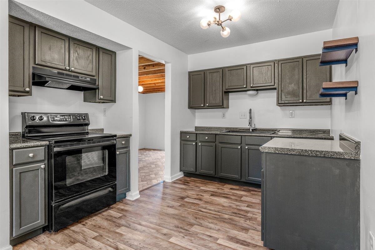 5626 Lamb Road Arlington, TN 38002 - Photo 10 of 33 a kitchen with stainless steel appliances a stove refrigerator and microwave